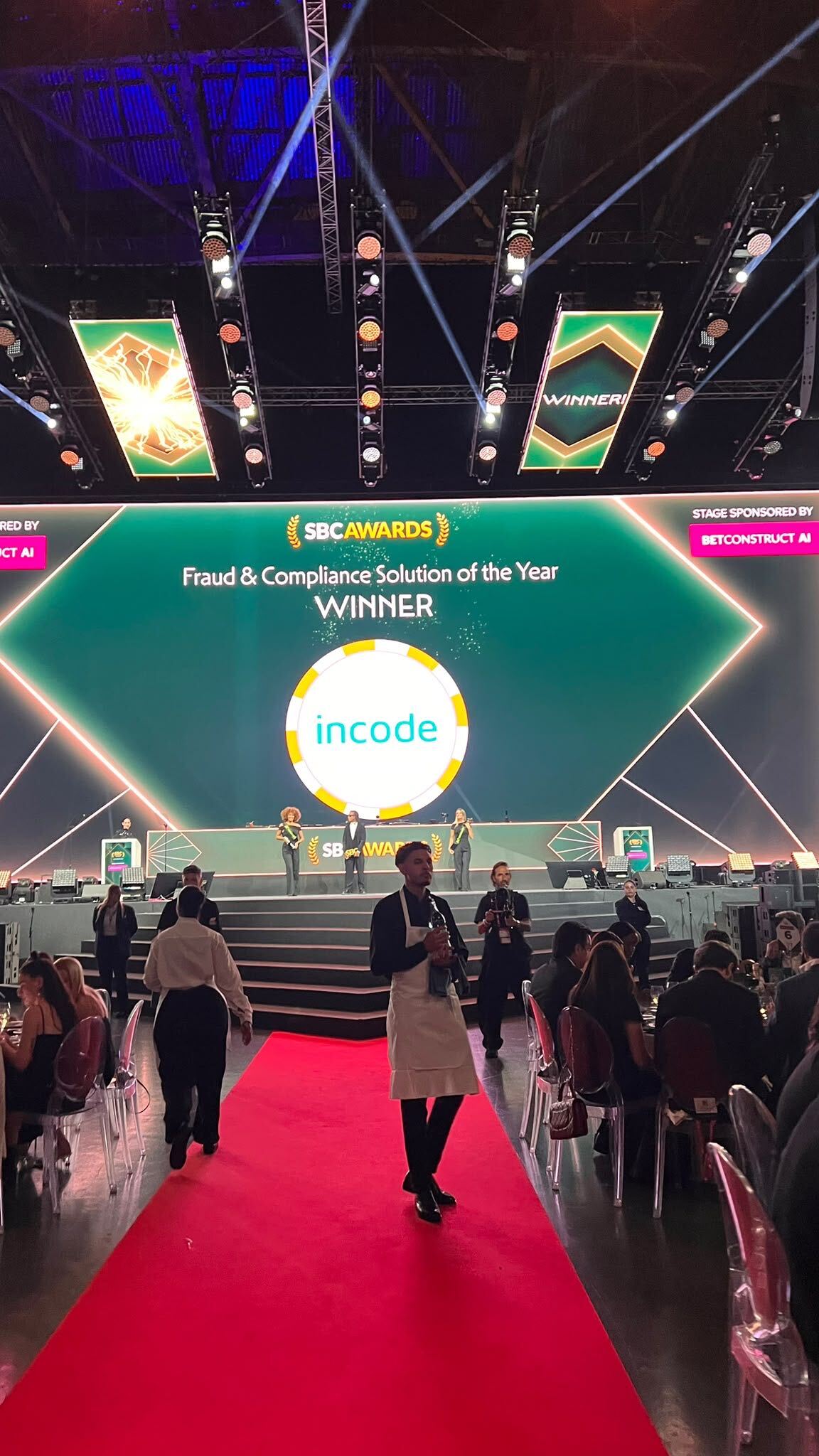 A photo from the SBC Awards ceremony, with Incode displayed on the screen as the winner of the Fraud & Compliance Solution of the Year.